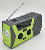 Solar powered hand charging NOAA radio with flashlight reading light in the United States