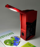 Solar powered hand charging NOAA radio with flashlight reading light in the United States