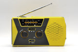 Solar powered hand charging NOAA radio with flashlight reading light in the United States